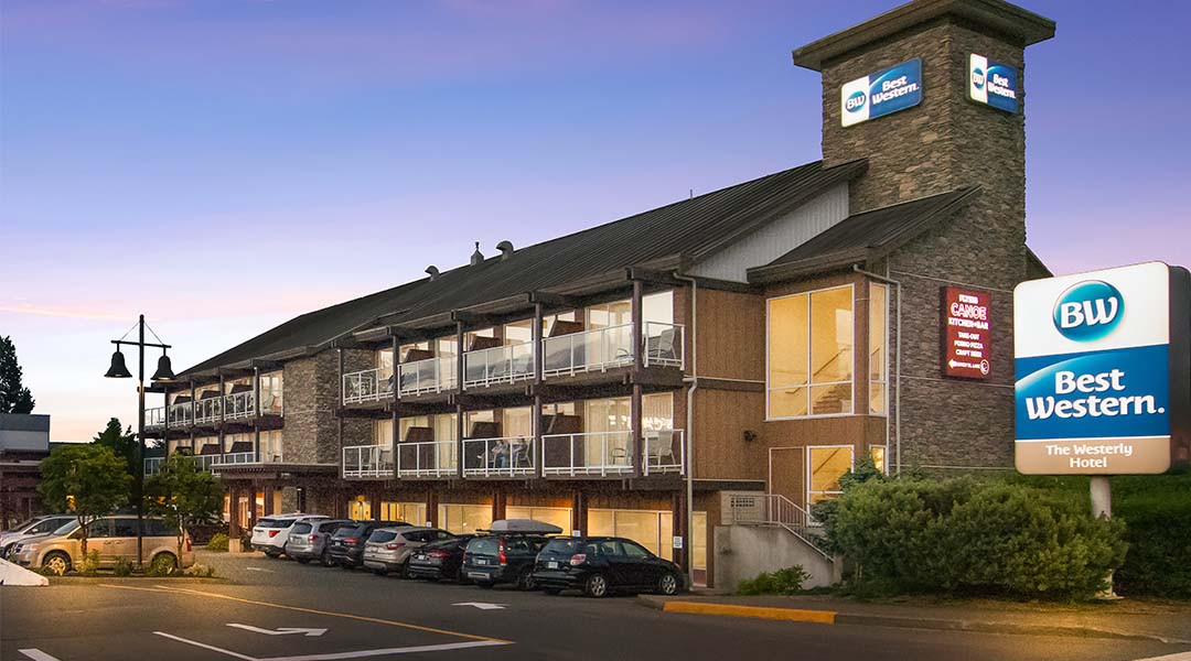 Exterior photo of hotel and sunset