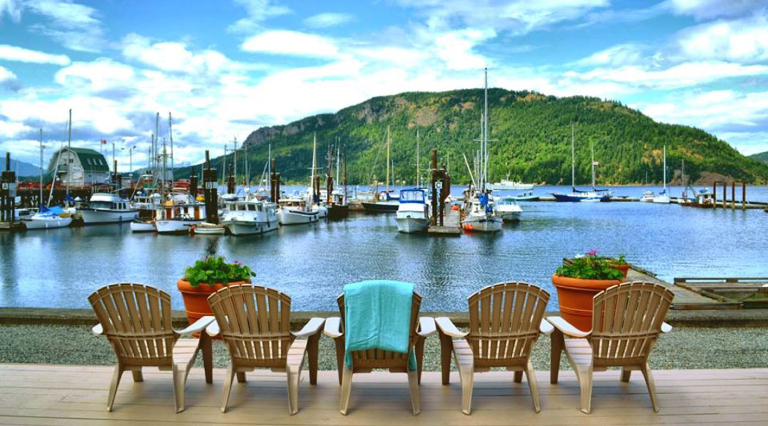 Chairs on the dock at Oceanfront Suites in Cowichan Bay