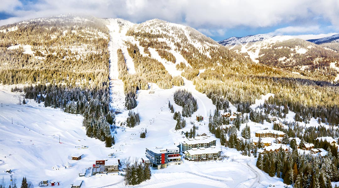 Aerial view of the Josie Hotel and mountains
