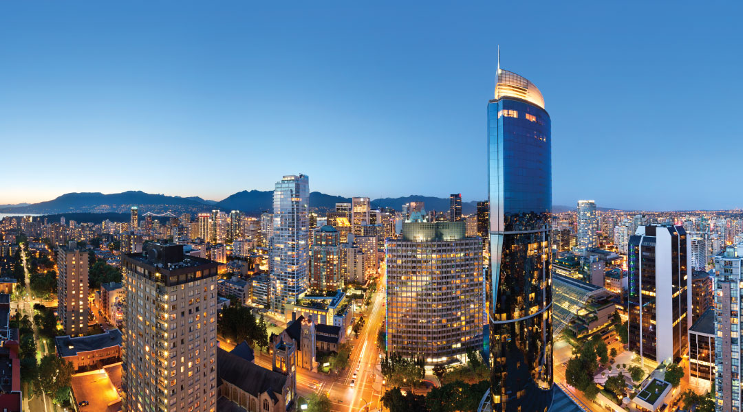 Aerial view of Sheraton Vancouver Wall Centre and the city at night