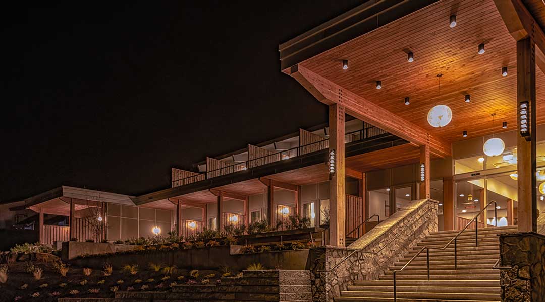 Exterior building and entrance of the Harbour House Hotel on Salt Spring Island at night
