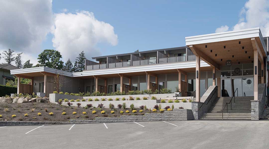 Exterior parking lot and entrance of the Harbour House Hotel on Salt Spring Island