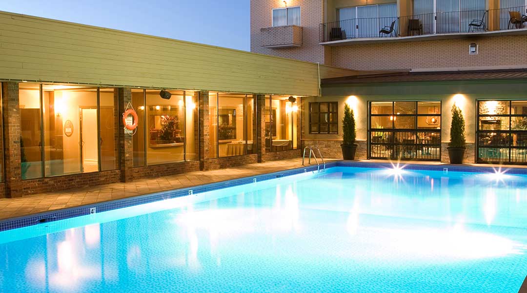 The outdoor pool in the evening at the Coast Capri Hotel in Kelowna in the Thompson Okanagan in the evening
