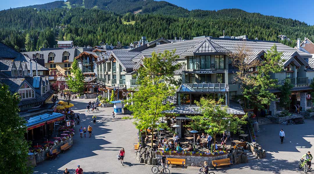 An aerial view of the exterior entrance and building to the Crystal Lodge and Suites in Whistler Village