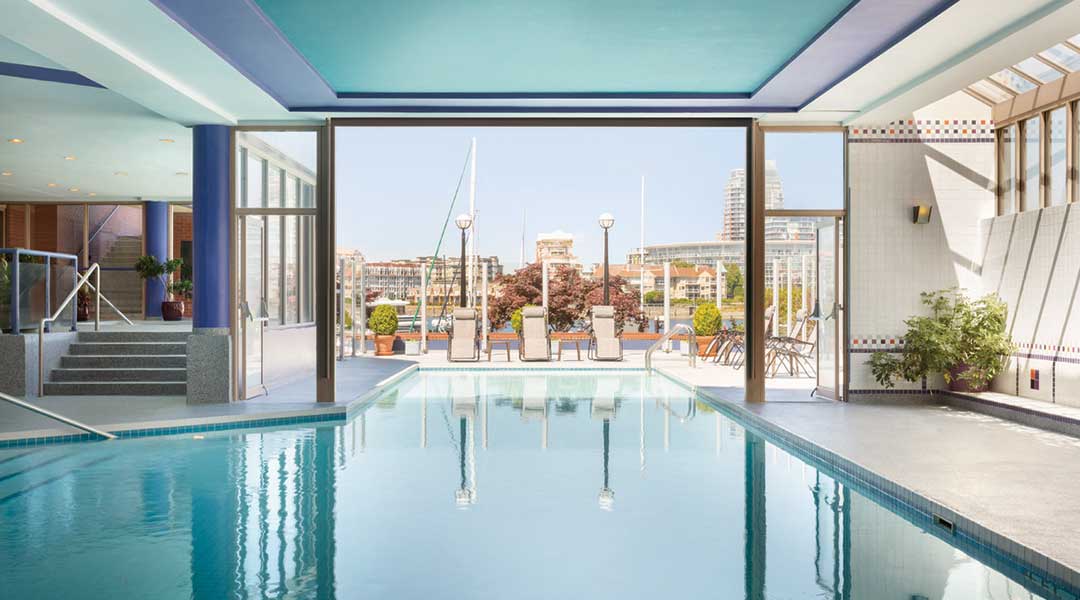 The indoor pool that leads out to the harbour at the Coast Victoria Hotel and Marina By APA on Vancouver Island