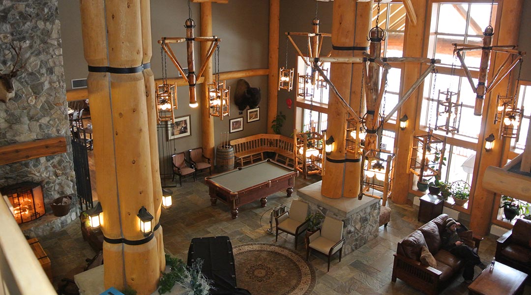 The interior lobby with a seating area and pool table at the Coast Hillcrest Hotel in Revelstoke