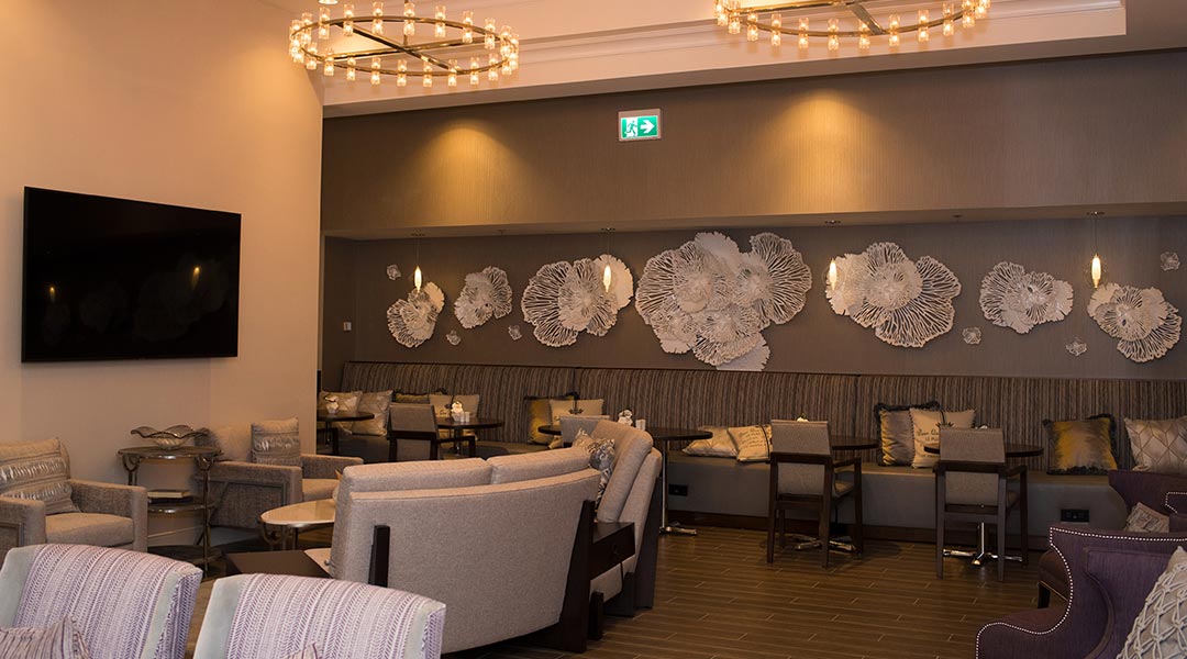 The seating area with TV in the M Club Lounge at the Victoria Marriott Inner Harbour in downtown Victoria on Vancouver Island