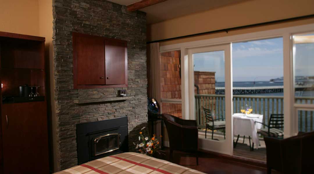 The oceanfront queen west coast suite room with a ocean view balcony at the Galiano Oceanfront Inn and Spa on Galiano Island