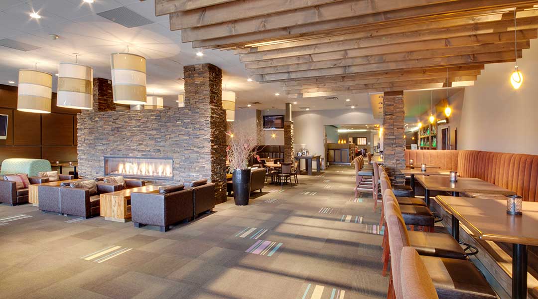 The Prestons Lounge with seating area and dining tables at the Coast Kamloops Hotel and Conference Centre in Thompson Okanagan