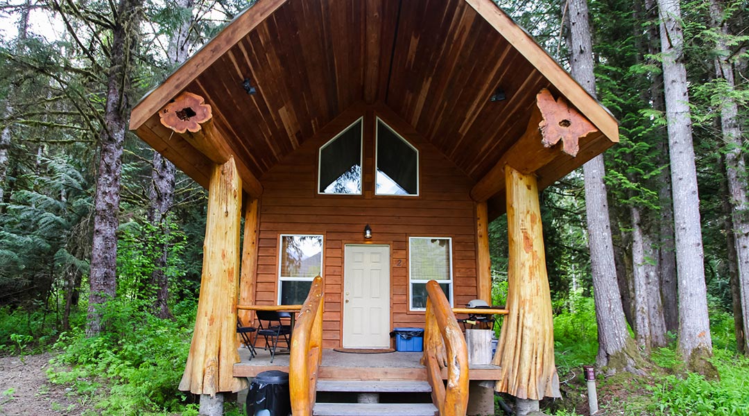 Exterior entrance and balcony of the Chalet One-Black Bear at the Bella Coola Grizzly Tours in the Cariboo Chilcotin Coast