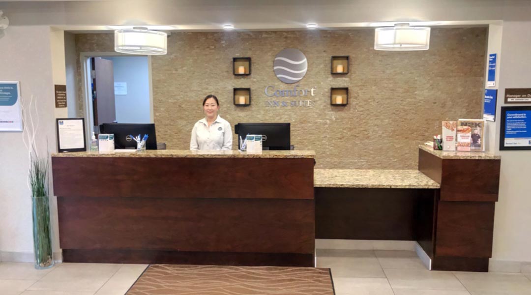 Person at the front lobby desk at the Comfort Inn and Suites Terrace in Northern BC