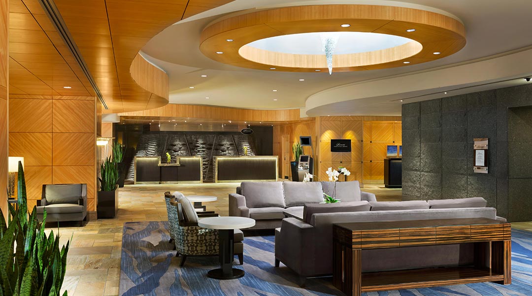 The interior lobby with a seating area at the Fairmont Vancouver Airport hotel near YVR in Richmond