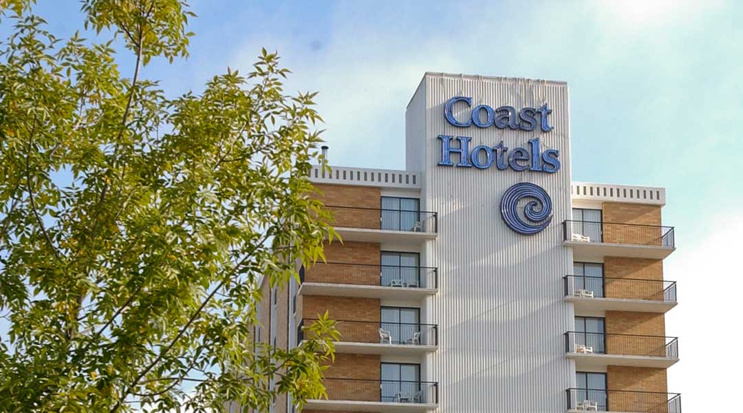 The exterior building and logo of the Coast Prince George Hotel by APA