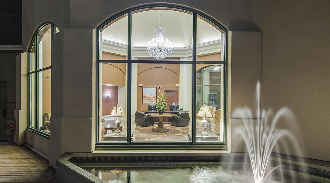 A window looking into the interior lobby at The Royal Kelowna in Thompson Okanagan