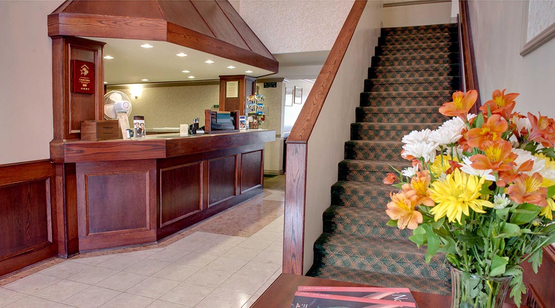 The lobby area and staircase at the Sandman Inn Smithers in Northern BC