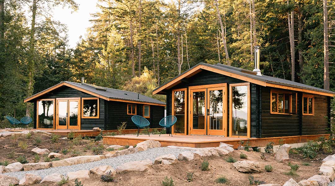 The exterior entrance to the wooden cabins of Bodega Cove on Galiano Island