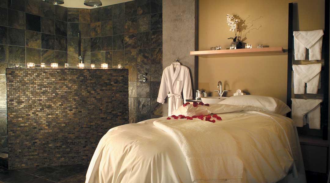 The spa facility and massage table with rose petals at the Brentwood Bay Resort and Spa on Vancouver Island